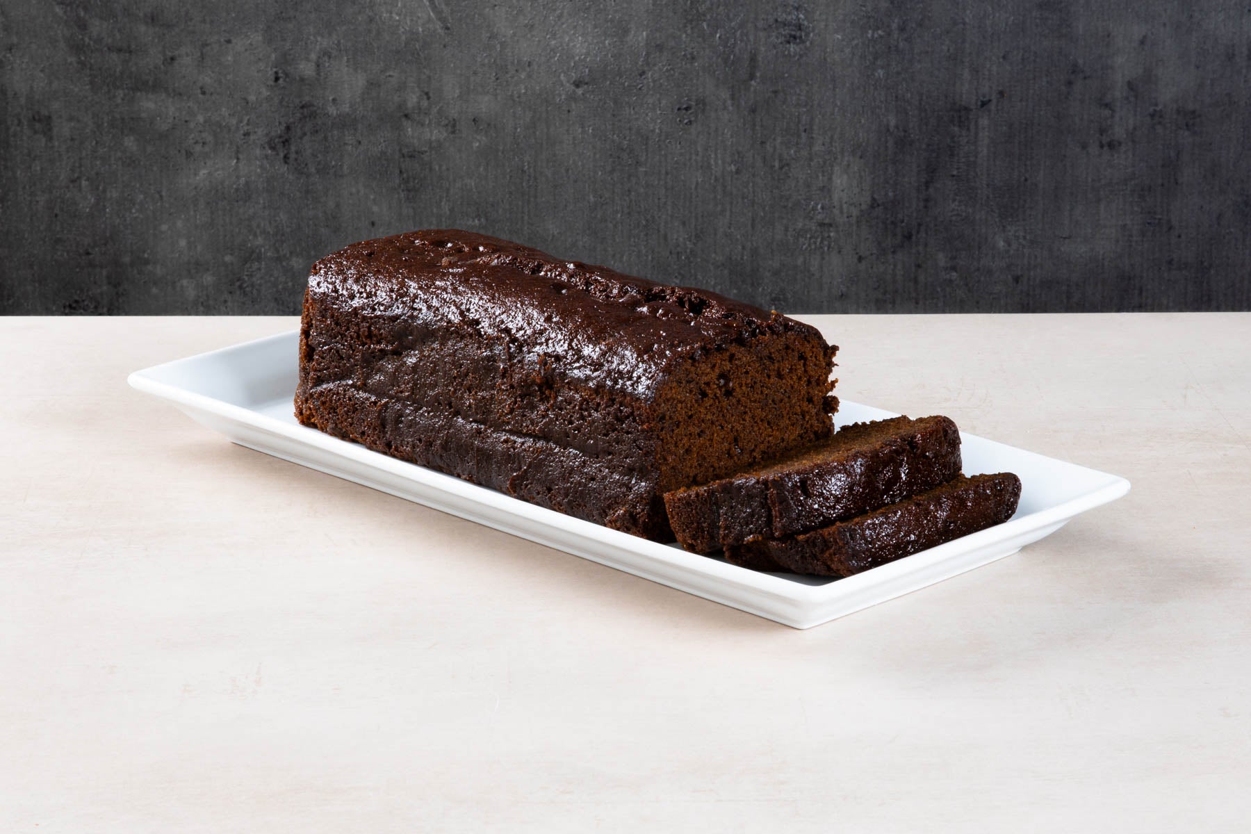 LHMC008-473.jpg Sliced coffee loaf cake with buttercream and chocolate buttons