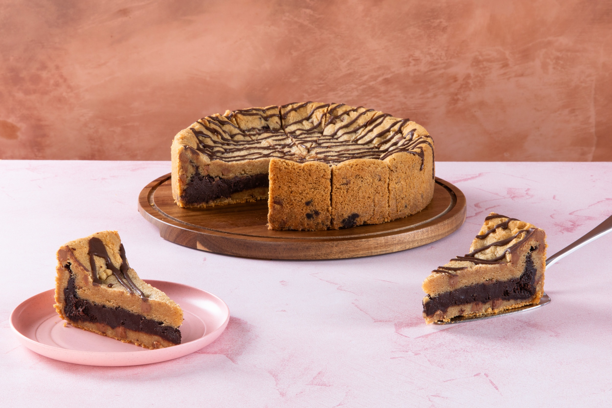 Milk Chocolate Cookie Pie Sliced chocolate brownie cookie pie with drizzle topping